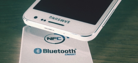 Smartphone hovers over bluetooth reader